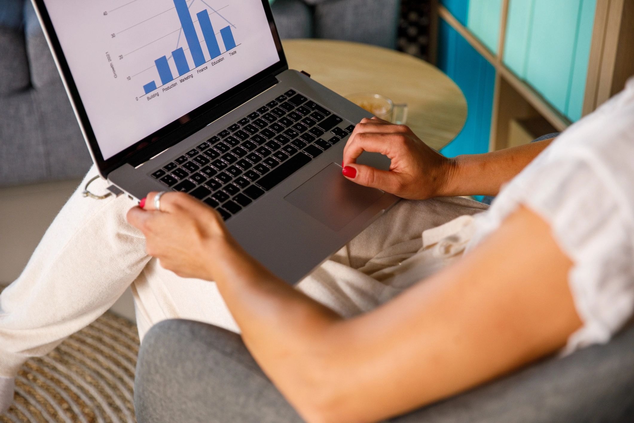 Professional reviewing website analytics on a laptop