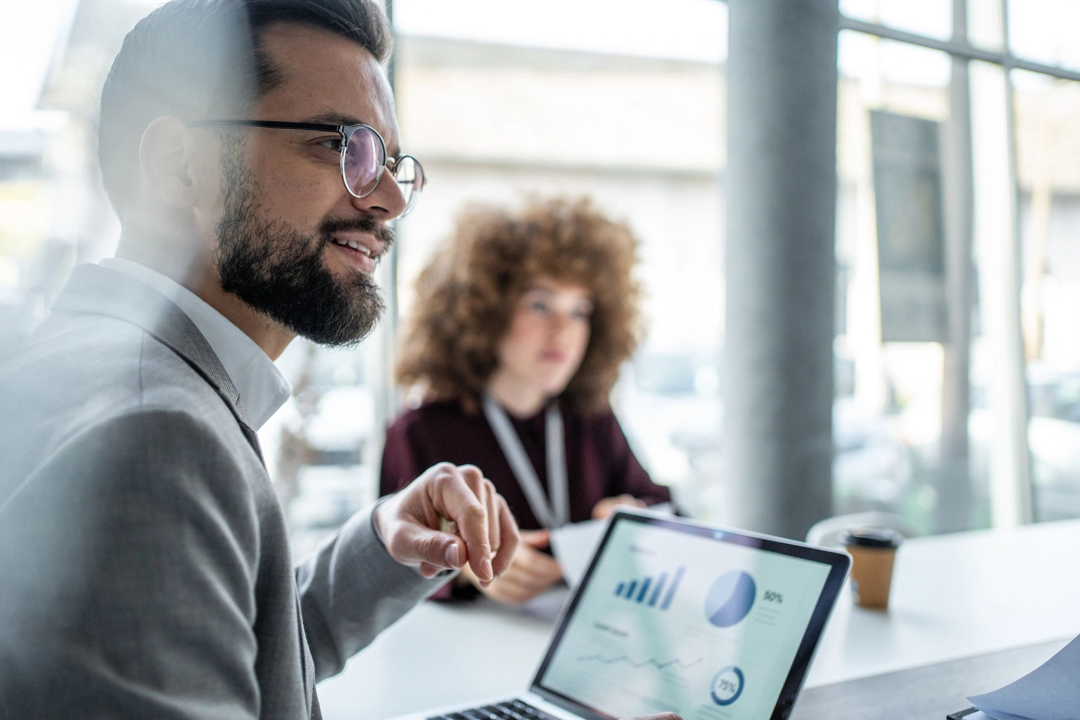 Business professional reviewing marketing performance on a laptop