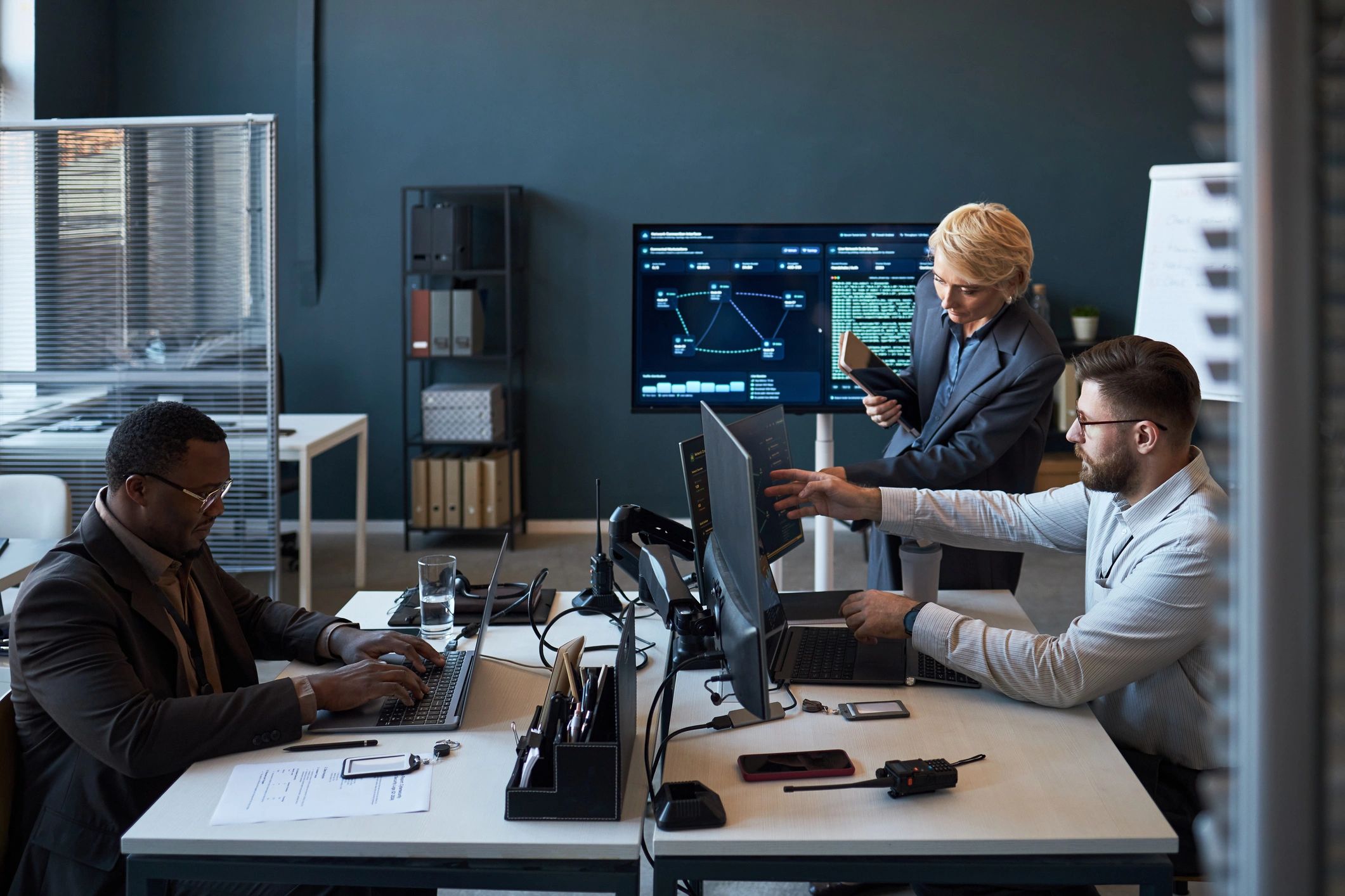 Secureloom team reviewing cybersecurity data together