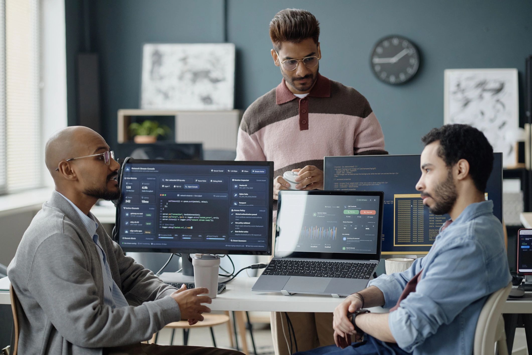 Technology professionals collaborating on web portal development